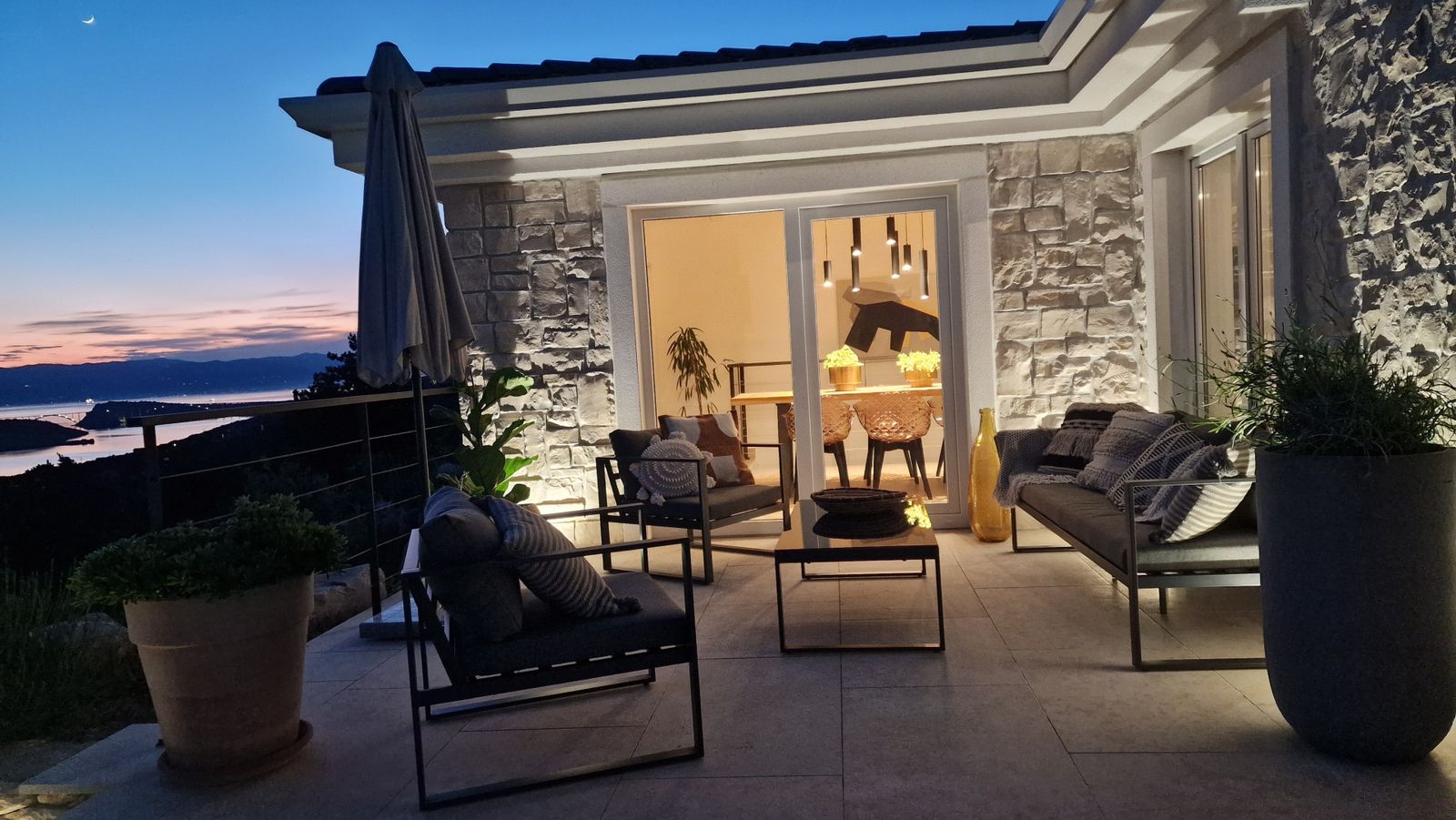The covered lounge at dusk at Villa Casa Bacchus